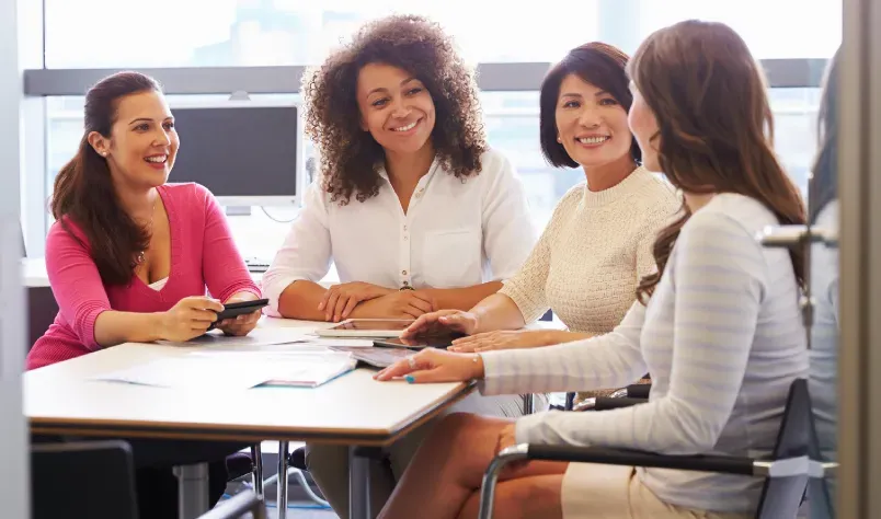 Women hotel owners at a conference table